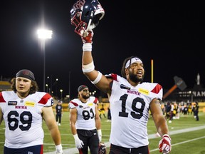 Alouettes linebacker Geoffrey Cantin-Arku (19) celebrates after Montreal defeated the Tiger-Cats in Hamilton, Ont., on Friday, August 2, 2024.