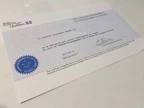 A blue certificate with a Quebec government logo