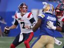 Alouettes QB Cody Fajardo drops back to throw during first game of the season in Winnipeg.