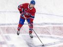 Canadiens defenceman Lane Hutson skates across the team's logo at centre ice during warmup before NHL game against the Detroit Red Wings at the Bell Centre on April 16, 2024.