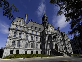 A summer view of city hall under blue skies.
