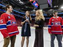 Suzane Landry, vice-president at Bell Media, second from right, and France Margaret Bélanger, president, sports and entertainment with Groupe CH, speak with players Alex Newhook, left, and Jayden Struble at the Bell Centre in Montreal Monday Sept. 9, 2024 following an advance screening of the Crave series Rebuild: Inside the Montreal Canadiens.