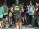 The final stretch of a marathon is the time for runners to tap into the energy of the crowd, writes columnist Jill Barker. Above: People offer encouragement near Lafontaine Park during the Montreal Marathon on Sept. 24, 2023.
