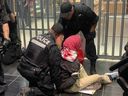 Montreal police arrest a pro-Palestinian protester in the Guy-Concordia métro station on Wednesday, Sept. 25, 2024.