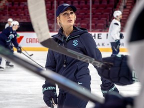 Jessica Campbell speaks to some Kraken players during practice