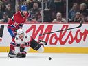 Canadiens' David Savard loses his stick as he defends against Senators' Shane Pinto during game last week at the Bell Centre.