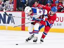 Artemi Panarin #10 of the New York Rangers and Kirby Dach #77 of the Montreal Canadiens skate after the puck during the first period at the Bell Centre on Oct. 22, 2024.