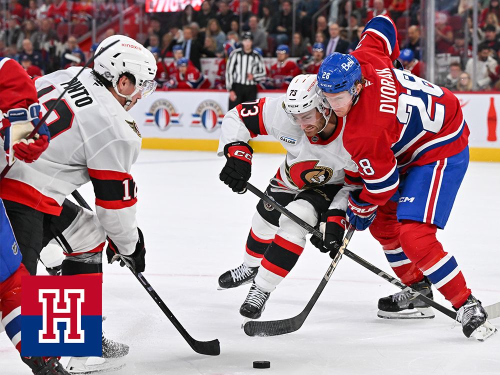 Noah Gregor of the Ottawa Senators and Christian Dvorak of the Montreal Canadiens battle for the puck during on Oct. 12, 2024.