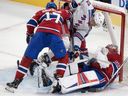 Montreal Canadiens' Josh Anderson (17) checks New York Rangers' Filip Chytil (72) into Canadiens goaltender Cayden Primeau (30) during third period NHL hockey action Tuesday, Oct. 22, 2024 in Montreal.