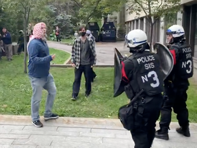 Pro-Palestinian protesters face off with Montreal police officers.