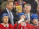 Canadiens head coach Martin St. Louis, right, speaks with assistant coach Trevor Letowski against the Lightning in Montreal on April 4, 2024. There's not a lot of NHL coaching experience behind Montreal's bench and it shows with all the defensive-zone breakdowns, Stu Cowan writes.
