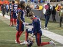 Alouettes James Letcher Jr., left, and Davis Alexander shake hands after their team's loss to the Toronto Argonauts in the Canadian Football League Eastern final in Montreal on Saturday, Nov. 9, 2024.
