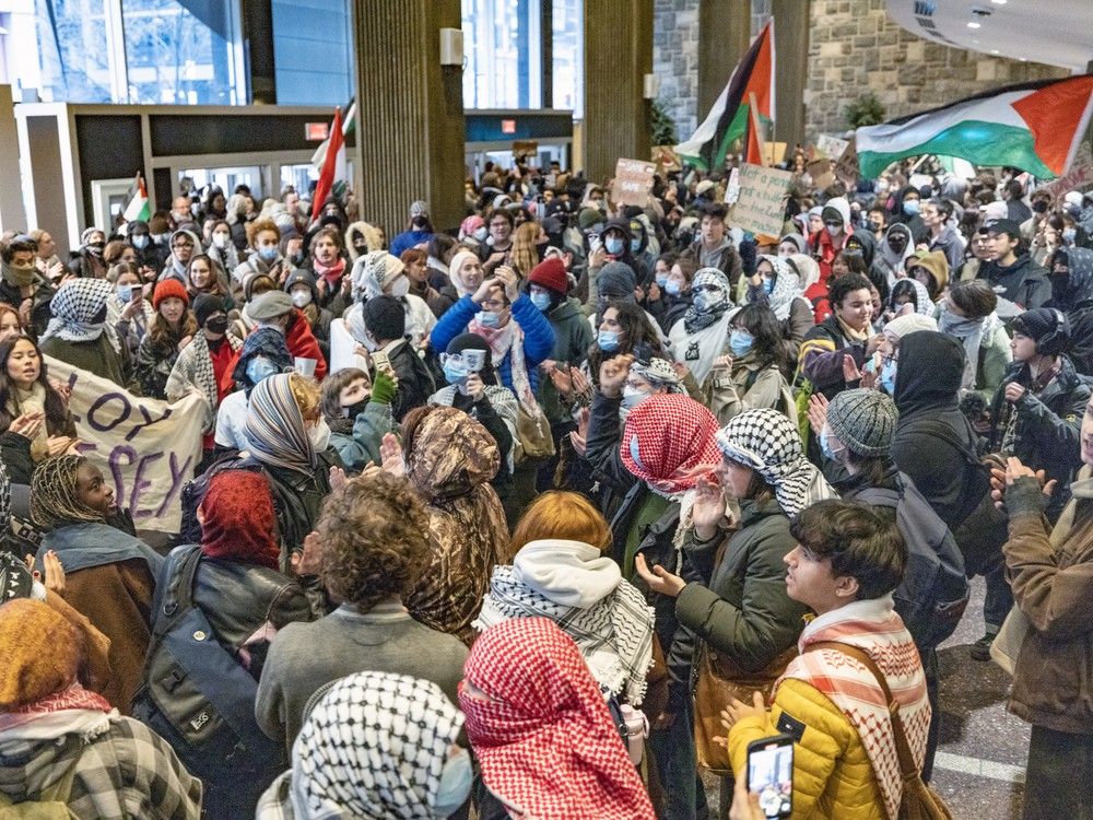Pro-Palestinian protesters in the lobby of the Henry F. Hall Building during a demonstration at Concordia University in Montreal Thursday Nov. 21, 2024.