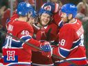 Montreal Canadiens Joel Armia, Nick Suzuki and Mike Matheson celebrate with teammate Jake Evans after his empty net goal against the Edmonton Oilers on Nov. 18, 2024.