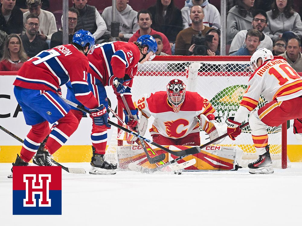 Christian Dvorak of the Montreal Canadiens skates the puck in towards goaltender Dustin Wolf of the Calgary Flames during the first period at the Bell Centre on Nov. 5, 2024.