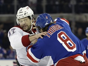 Canadiens right wing Josh Anderson fights New York Rangers defenseman Jacob Trouba in the first period of game Saturday, Nov. 30, 2024, in New York.