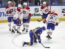 Sabres centre Dylan Cozens, front, reacts after Canadiens players celebrate scoring an empty-net goal to secure Monday's wild 7-5 win in Buffalo.
