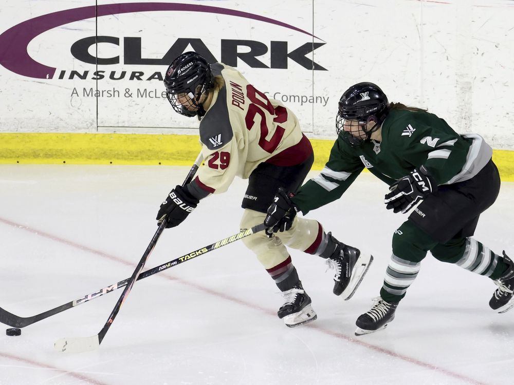 Montreal forward Marie-Philip Poulin (29) and Boston defender Emily Brown (2) chase the puck during the first period of a PWHL playoff game in Lowell, Mass., last season. The excitement remains high for the Montreal Victoire heading into a second PWHL season.