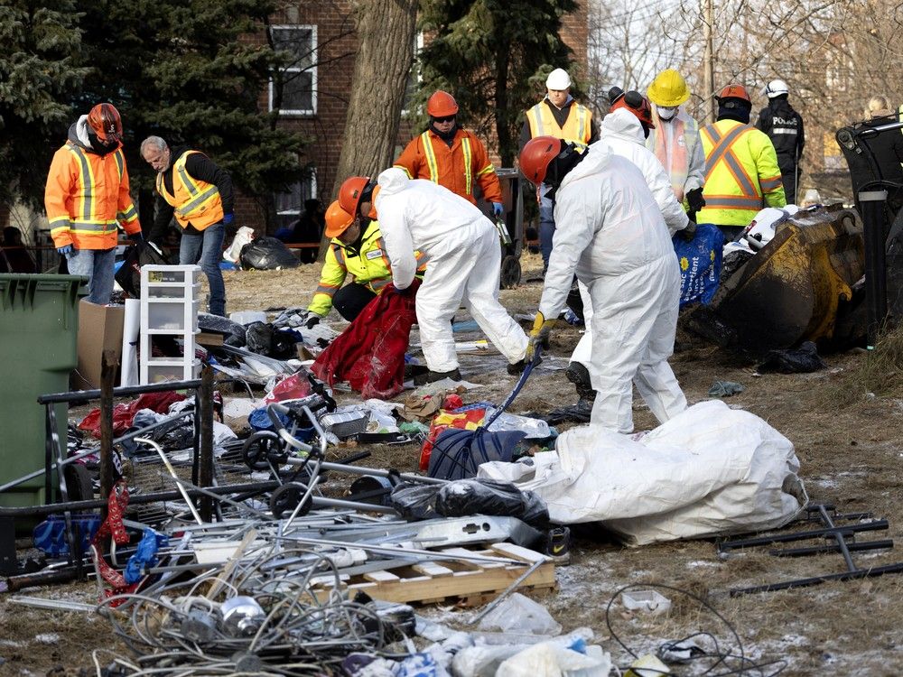  workers, with the help of montreal police, clear the notre-dame st. encampment in montreal, on monday, dec. 2, 2024.