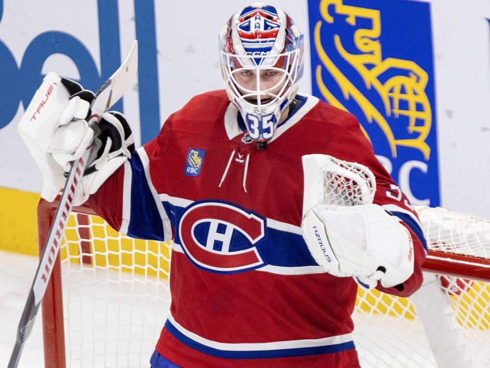 Montreal Canadiens' Sam Montembeault pumps his fists in front of the net