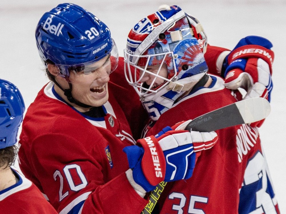 Canadiens Juraj Slafkovsky' hugs goalie Sam Montembeault after a shutout victory over the Nashville Predators in Montreal on Thursday, Dec. 5, 2024.