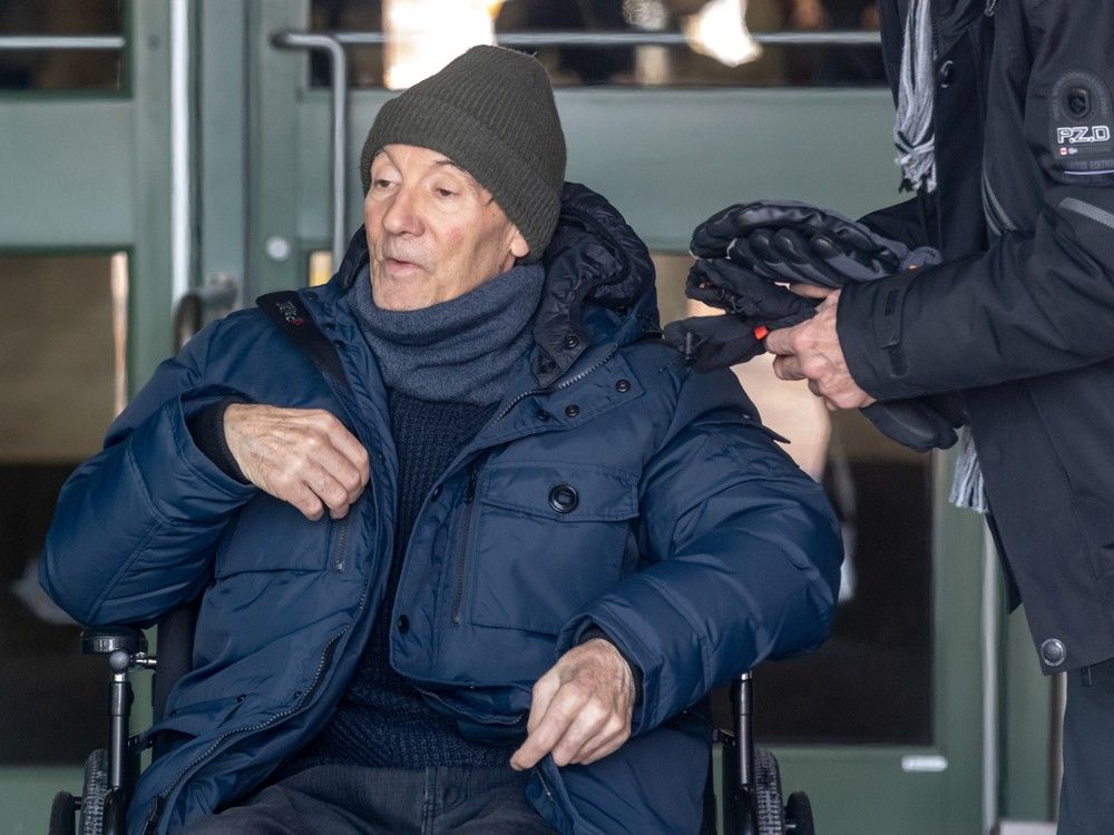françois lamarre, in a wheelchair, leaves the longueuil courthouse after his arraignment on dec. 19, 2019.