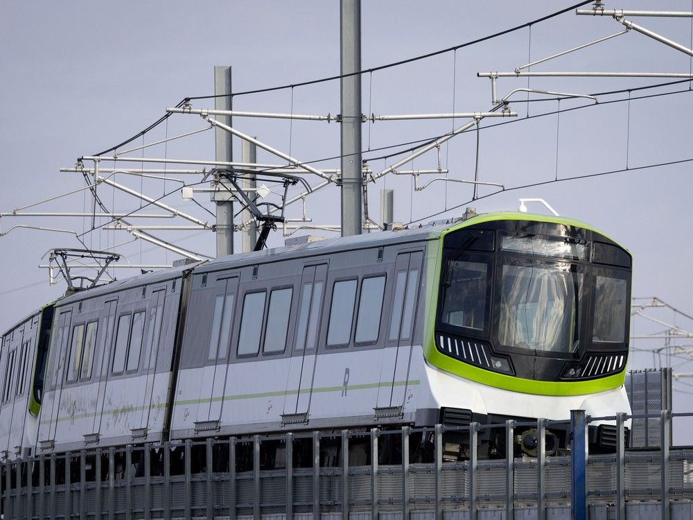 a rem train runs along an elevated track.