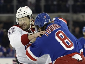 Right winger Josh Anderson fights Rangers defenseman Jacob Trouba in the first period of their Saturday game in New York.