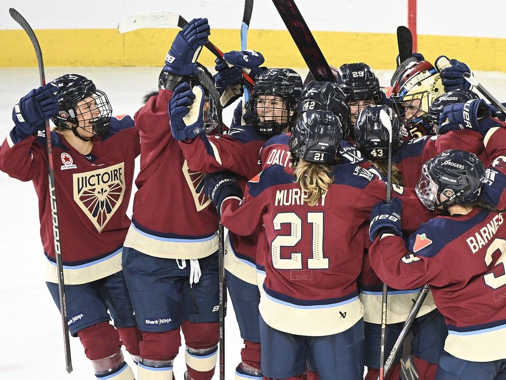 La Victoire players celebrate their win over the Ottawa Charge in a PWHL hockey game in Laval on Nov. 30, 2024. The team's oldest player, 33-year-old superstar Marie-Philip Poulin, was not yet born at the time of the École Polytechnique massacre.