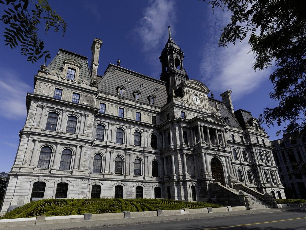 a side view of montreal city hall on a sunny day.