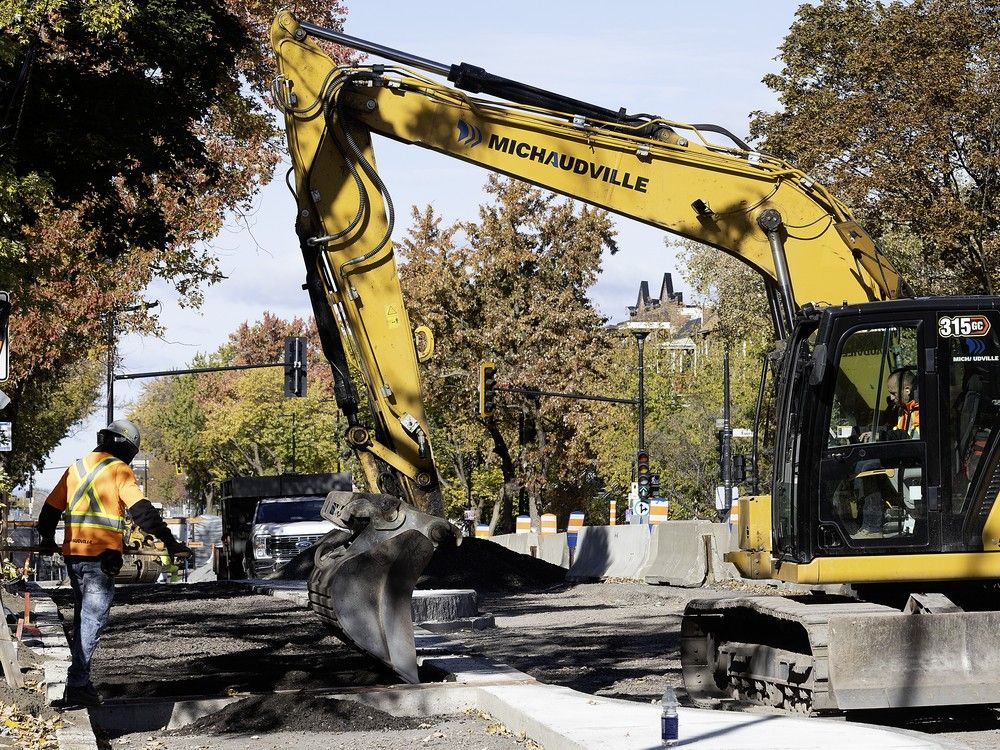 digger does roadwork on christophe-colomb bike path