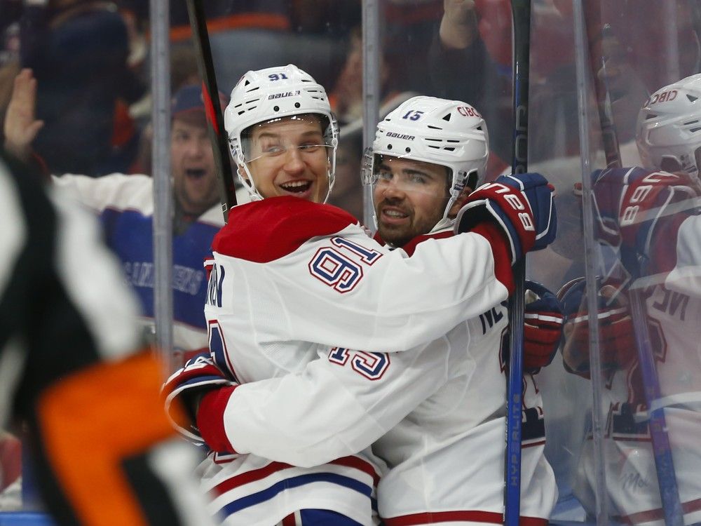  Canadiens’ Oliver Kapanen, left, and Alex Newhook celebrate a goal against the Oilers during the first period in Edmonton on Thursday night.