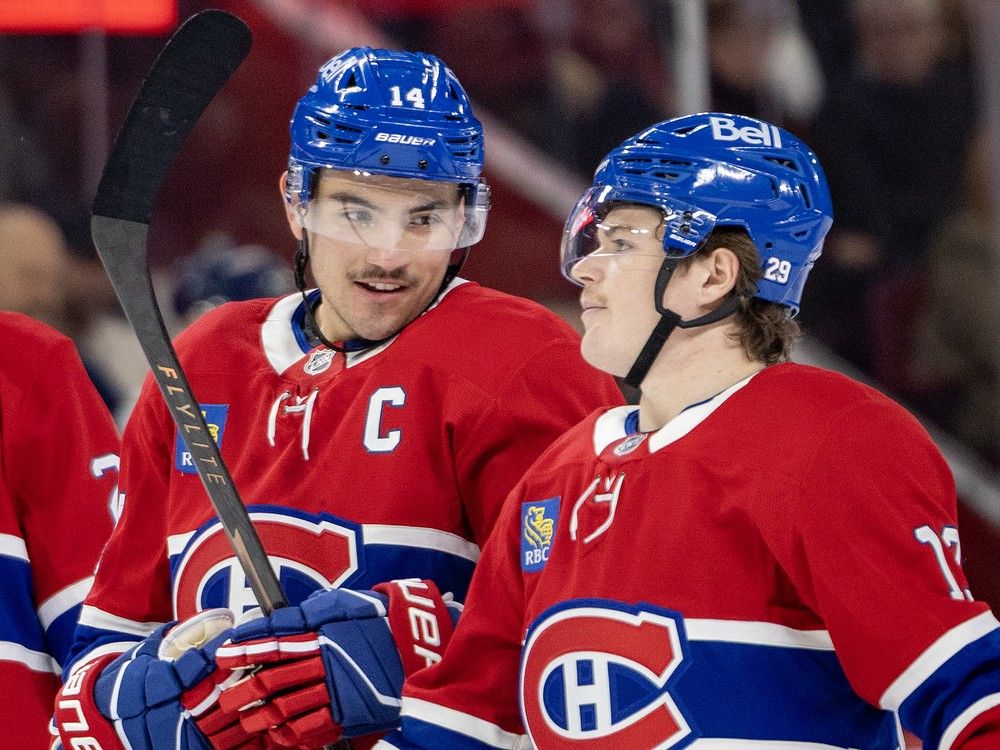 Canadiens captain Nick Suzuki, left, and Cole Caufield confer during first period against the Washington Capitals in Montreal on Thursday night. Canadiens captain Nick Suzuki, left, and Cole Caufield confer during first period against the Washington Capitals in Montreal on Thursday night.
