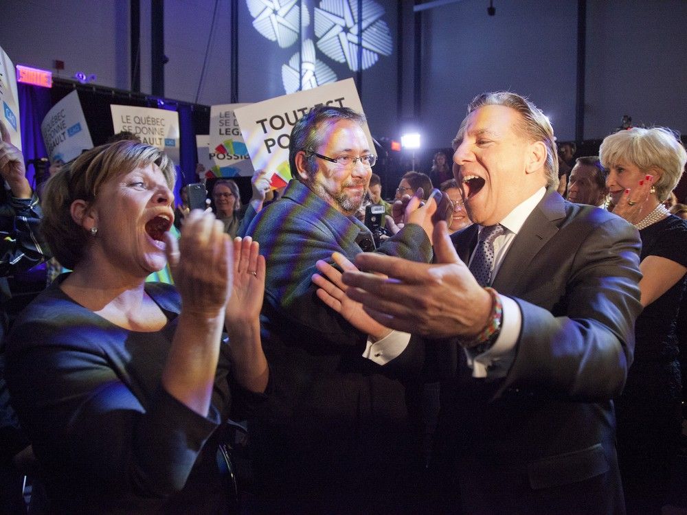  CAQ Leader François Legault and wife, Isabelle Brais, greet supporters after Quebec election results April 7, 2014.