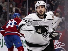 Hockey player skates up the ice.