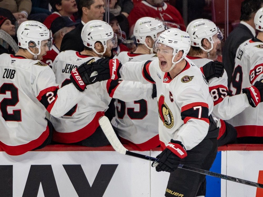  Ottawa Senators’ Brady Tkachuk celebrates his third period goal against the Montreal Canadiens with teammate Artem Zub during a National Hockey League game in Montreal Tuesday Dec. 2, 2025.