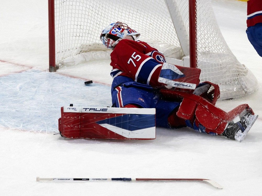 Canadiens goaltender Jakub Dobes (75) looks back to see the Tampa Bay Lightning have scored after he lost control of his stick during the first period. Canadiens goaltender Jakub Dobes (75) looks back to see the Tampa Bay Lightning have scored after he lost control of his stick during the first period.