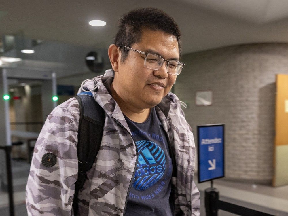 Yuesheng Wang walks through the Palais de Justice in Longueuil.