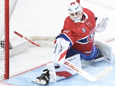 Montreal Canadiens goaltender Jacob Fowler makes a save against the Pittsburgh Penguins during second period NHL hockey action in Montreal, Saturday, Dec. 20, 2025.