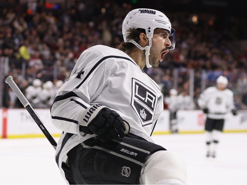 Hockey player reacts after scoring a goal.
