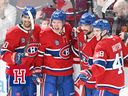 Montreal Canadiens' Owen Beck (62) celebrates with teammates Joe Veleno (90), Alexandre Carrier (45) and Lane Hutson (48) after scoring against the Pittsburgh Penguins during first period in Montreal on Dec. 20.