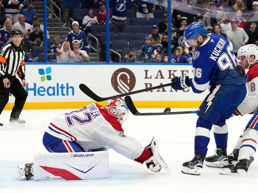 Montreal Canadiens goaltender Jacob Fowler stops a shot by Tampa Bay Lightning right wing Nikita Kucherov.