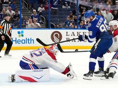 Montreal Canadiens goaltender Jacob Fowler stops a shot by Tampa Bay Lightning right wing Nikita Kucherov.