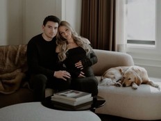 Canadien's Nick Suzuki and his wife, Caitlin Fitzgerald with their dog at home.