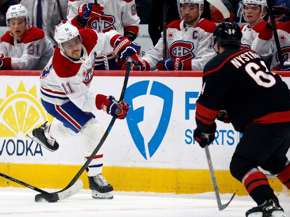  Canadiens winger Brendan Gallagher makes a pass as Carolina Hurricanes’ Joel Nystrom approaches during the third period in Raleigh, N.C., on Thursday.