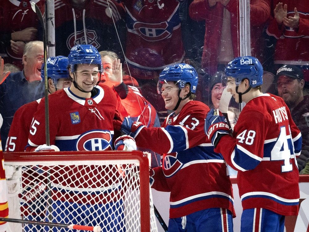Canadiens Alexandre Texier (85), left to right, Cole Caufield (13) and Lane Hutson (48) celebrate scoring against the Calgary Flames during second period NHL action in Montreal, on Wednesday, Jan. 7, 2026. Canadiens Alexandre Texier (85), left to right, Cole Caufield (13) and Lane Hutson (48) celebrate scoring against the Calgary Flames during second period NHL action in Montreal, on Wednesday, Jan. 7, 2026.