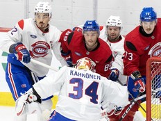 Goalie Kaapo Kahkonen defends net as Arber Xhekaj, from left, Joshua Roy, Xavier Simoneau and Wyatte Wylie look on during Canadiens' training camp in Brossard on Sept. 18, 2025.
