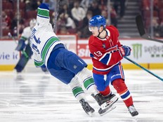 Canadiens winger Cole Caufield checks Vancouver Canucks' Linus Karlsson during second period in Montreal on Jan. 12.