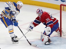 Hockey player scores on a goaltender.