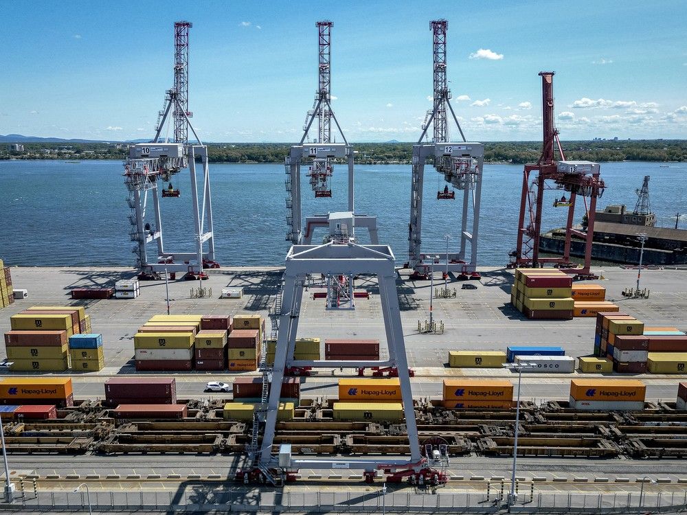 Shipping containers are stacked at the Port of Montreal.